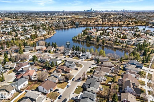 Aerial perspective showcasing a residential area with varied housing styles - 10673 161 Avenue, Edmonton, AB - Outdoor With Body Of Water With View