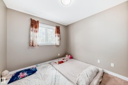 Room featuring neutral-toned walls, white trim, and carpet flooring - 