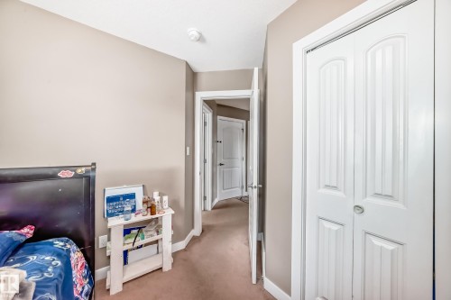Interior hallway with light beige walls and carpeting - 1 12833 123 Street, Edmonton, AB - Indoor