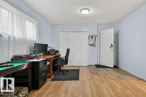 Light wood-finish flooring throughout the space - 157 Kiniski Crescent, Edmonton, AB - Indoor Photo Showing Office