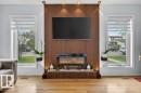 Accent wall featuring vertical wood paneling - 157 Kiniski Crescent, Edmonton, AB  - Indoor Photo Showing Living Room With Fireplace 