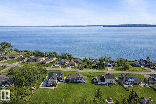 This property is located in a community with lake views - 1513 Horseshoe Bay Estates, Cold Lake, AB - Outdoor With Body Of Water With View
