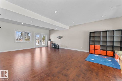 Expansive room featuring hardwood floors, recessed lighting, and a neutral color palette - 1513 Horseshoe Bay Estates, Cold Lake, AB - Indoor