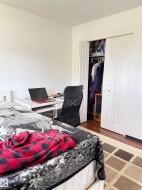 Room featuring white walls and textured ceiling - 