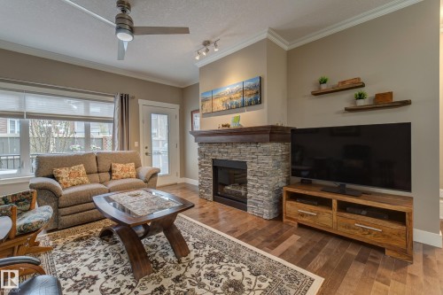 210 50 Heatherglen Drive, Spruce Grove, AB - Indoor Photo Showing Living Room With Fireplace