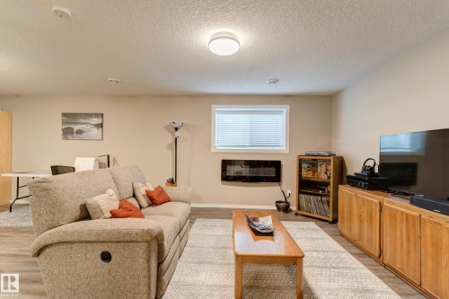210 50 Heatherglen Drive, Spruce Grove, AB - Indoor Photo Showing Living Room With Fireplace