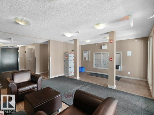 Common area featuring wood-finish flooring, recessed lighting, and individual mailboxes - 216 5390 Chappelle Road, Edmonton, AB - Indoor