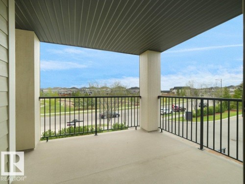 Private balcony with a concrete floor and black metal railings - 216 5390 Chappelle Road, Edmonton, AB - Outdoor With Balcony With Exterior