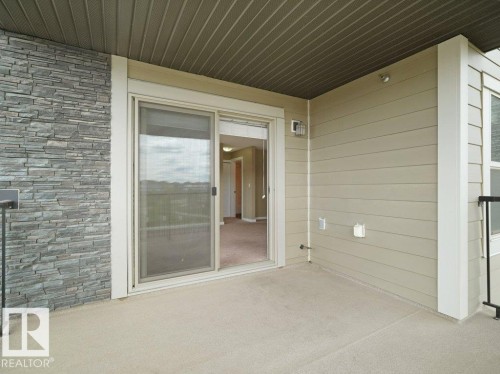 Private patio space featuring a concrete surface - 216 5390 Chappelle Road, Edmonton, AB - Outdoor With Exterior