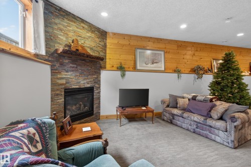 21 Beaverhill View Cr, Tofield, AB - Indoor Photo Showing Living Room With Fireplace