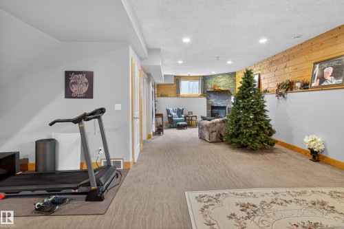 21 Beaverhill View Cr, Tofield, AB - Indoor Photo Showing Gym Room