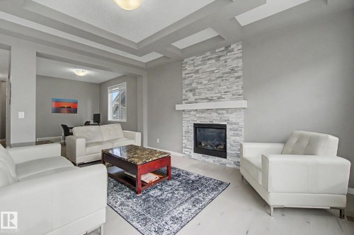 2233 56 Street, Edmonton, AB - Indoor Photo Showing Living Room With Fireplace