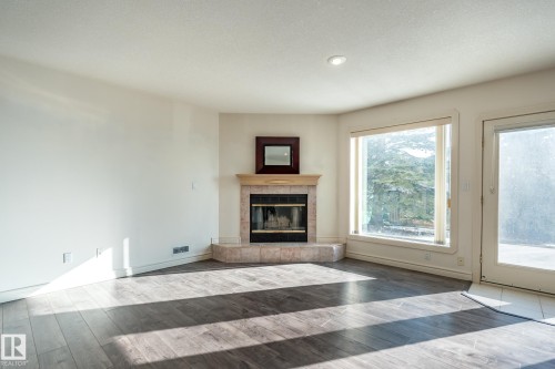 189 Blackburn Drive W, Edmonton, AB - Indoor Photo Showing Living Room With Fireplace