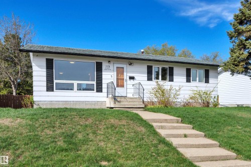 White exterior with dark window trim and shutters - 112 Oak Drive, Wetaskiwin, AB - Outdoor