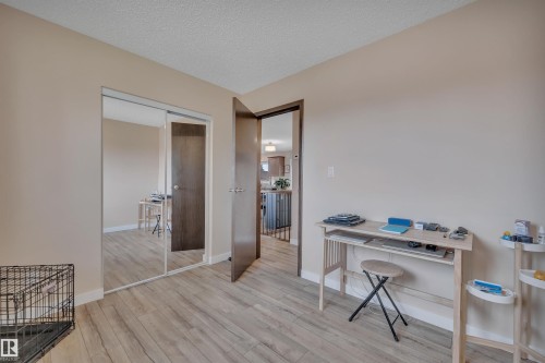 Neutral tone walls with light wood-finish flooring - 112 Oak Drive, Wetaskiwin, AB - Indoor Photo Showing Office