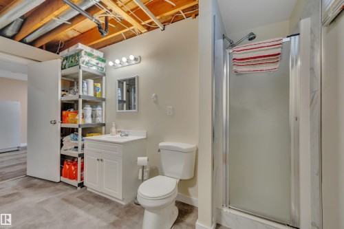 Bathroom with a white vanity and sink, a toilet, and a glass-enclosed shower - 112 Oak Drive, Wetaskiwin, AB - Indoor
