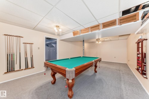 Recreation room featuring a classic billiards table with a green felt surface and wood-finish frame - 9528 189 Street, Edmonton, AB - Indoor Photo Showing Other Room