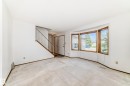 Bright interior with a bay window featuring wood-frame windows - 9528 189 Street, Edmonton, AB  - Indoor Photo Showing Other Room 