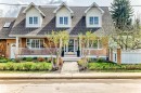 Brick facade residence featuring three dormer windows, a covered front porch with white railing, a central stone pathway, mature landscaping, and an integrated fence - 11115 44 Street, Edmonton, AB  - Outdoor With Deck Patio Veranda With Facade 