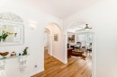Hardwood-finish flooring throughout, featuring arched doorways and crown molding - 11115 44 Street, Edmonton, AB  - Indoor Photo Showing Other Room 