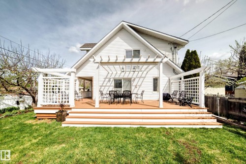 Expansive multi-level wood-finish deck with integrated white lattice pergolas - 11115 44 Street, Edmonton, AB - Outdoor With Deck Patio Veranda