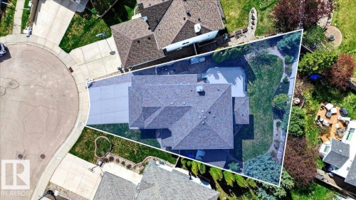Spacious property featuring a large asphalt shingle roof, extensive driveway, and a generously sized rear yard with mature landscaping and a visible swimming pool - 11824 13 Avenue, Edmonton, AB - Outdoor With Exterior