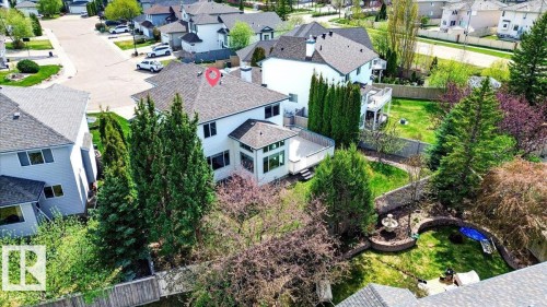 Two-story residence featuring a white exterior and a dark shingle roof - 11824 13 Avenue, Edmonton, AB - Outdoor