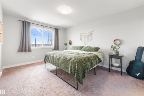 This room features light-colored walls and soft carpeting - 607 40 Street Sw, Edmonton, AB - Indoor Photo Showing Bedroom