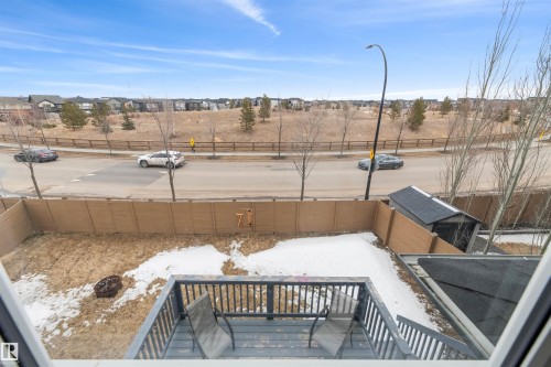 The property features a wooden deck with railing, a storage shed, and a fenced backyard - 607 40 Street Sw, Edmonton, AB - Outdoor