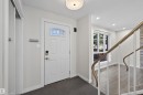 Entryway featuring a white paneled door with stained glass transom, smart lock, and a contemporary flush-mount ceiling light - 15251 88A Street, Edmonton, AB  - Indoor Photo Showing Other Room 