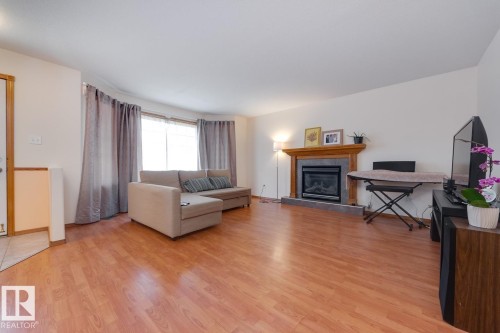 10816 67 Avenue, Edmonton, AB - Indoor Photo Showing Living Room With Fireplace