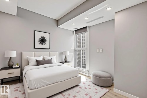 Contemporary bedroom featuring light wood-finish flooring and recessed ceiling lighting - #1601 10180 103 St Nw, Edmonton, AB - Indoor Photo Showing Bedroom