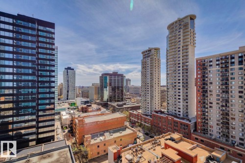 Urban skyline featuring varied architectural styles and multiple high-rise structures - #1601 10180 103 St Nw, Edmonton, AB - Outdoor With Facade