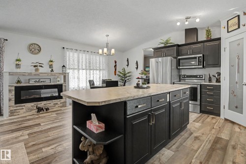 15 12604 153 Avenue, Edmonton, AB - Indoor Photo Showing Kitchen With Fireplace With Upgraded Kitchen