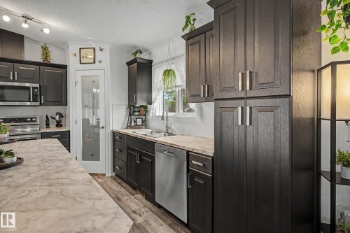 15 12604 153 Avenue, Edmonton, AB - Indoor Photo Showing Kitchen With Stainless Steel Kitchen With Double Sink
