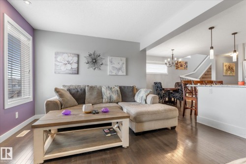 Open concept living area featuring dark wood-finish flooring - 3 Richmond Link, Fort Saskatchewan, AB - Indoor Photo Showing Living Room