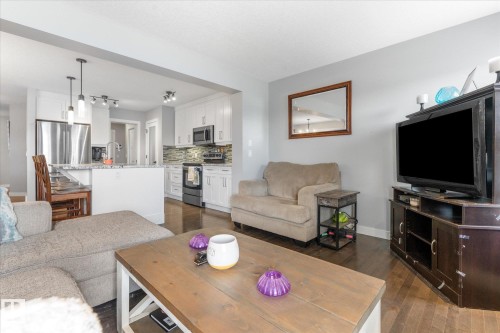 Open-concept living area with dark wood-finish flooring - 3 Richmond Link, Fort Saskatchewan, AB - Indoor Photo Showing Living Room