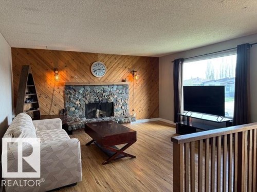 8804 29 Avenue, Edmonton, AB - Indoor Photo Showing Living Room With Fireplace