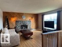 8804 29 Avenue, Edmonton, AB  - Indoor Photo Showing Living Room With Fireplace 