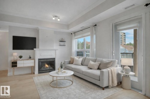 306 10232 115 Street, Edmonton, AB - Indoor Photo Showing Living Room With Fireplace