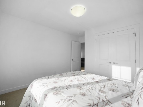 Bright interior space featuring a flush mount ceiling light, white walls, and carpet flooring - 30 Hope Cm, Spruce Grove, AB - Indoor Photo Showing Bedroom