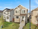 Contemporary two-story residence with a multi-toned exterior facade, including horizontal siding and shingle accents - 30 Hope Cm, Spruce Grove, AB  - Outdoor With Facade 