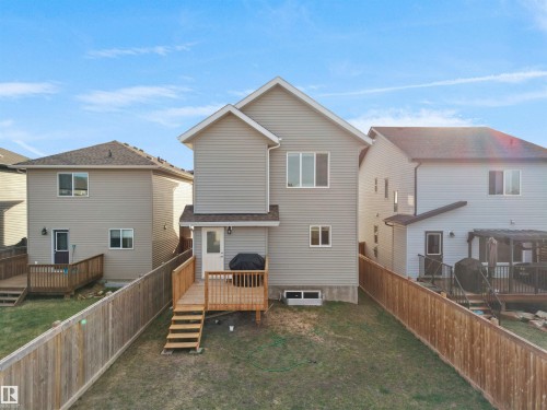 Rear exterior of a two-story residence featuring light gray siding - 30 Hope Cm, Spruce Grove, AB - Outdoor With Exterior