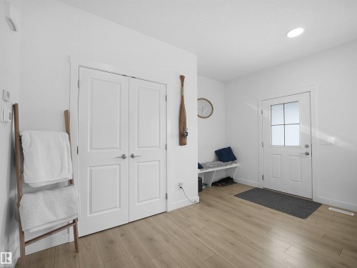 Entryway featuring wood-finish flooring, white walls, and recessed lighting - 30 Hope Cm, Spruce Grove, AB - Indoor Photo Showing Other Room