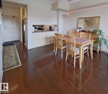 Rich wood-finish flooring throughout the dining area and entry - 