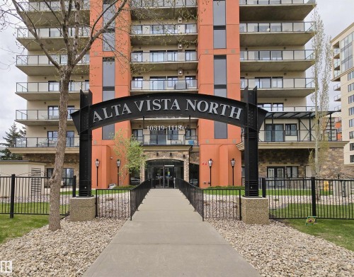 Multi-story residential building featuring a stone and stucco facade - 707 10319 111 Street Nw, Edmonton, AB - Outdoor With Balcony With Facade