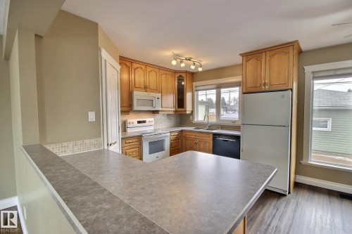 6003 90 Avenue, Edmonton, AB - Indoor Photo Showing Kitchen With Double Sink