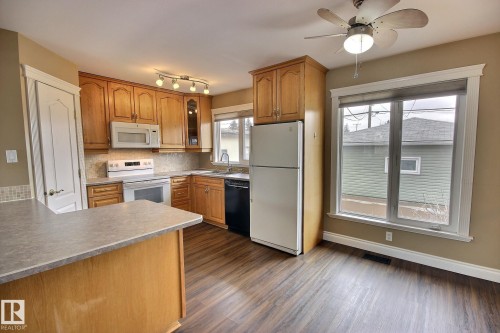 6003 90 Avenue, Edmonton, AB - Indoor Photo Showing Kitchen With Double Sink