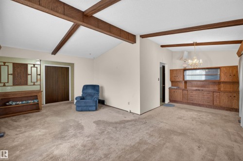 Vaulted ceilings with exposed wood beams - 8407 150 Avenue, Edmonton, AB - Indoor Photo Showing Other Room