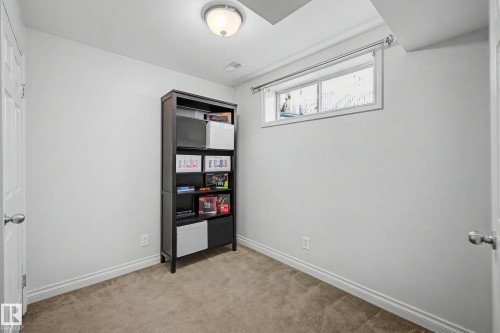 Carpeted room with white walls, a single window, and a flush-mount ceiling light fixture - 16211 55A Street, Edmonton, AB - Indoor Photo Showing Other Room